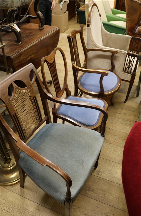 An Edwardian mahogany armchair and three Edwardian inlaid chairs